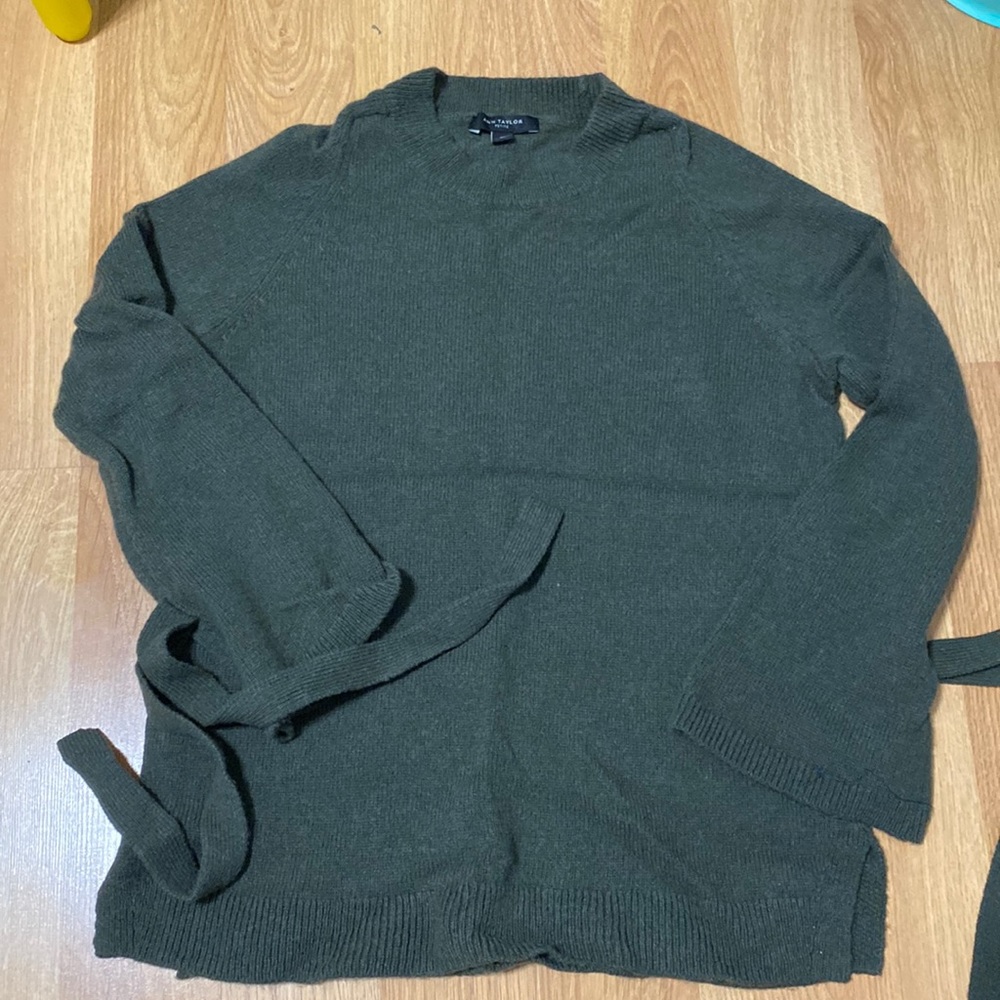 Army green sweater never worn.  Ties at end of sleeves.